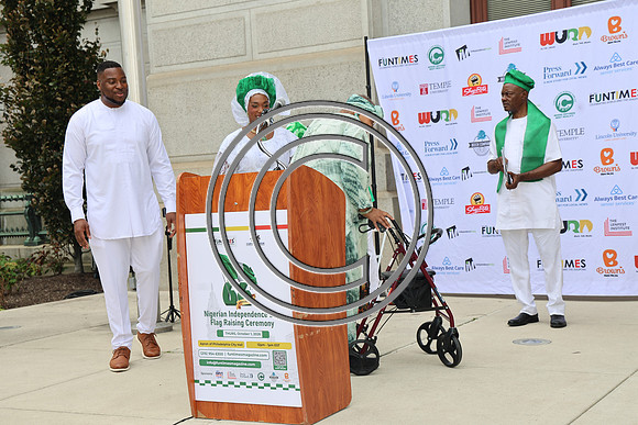 PHSL0065. Nigerian Flag-raising Ceremony at City Hall for Funtimes Magazine October 1, 2026 ktiplaura